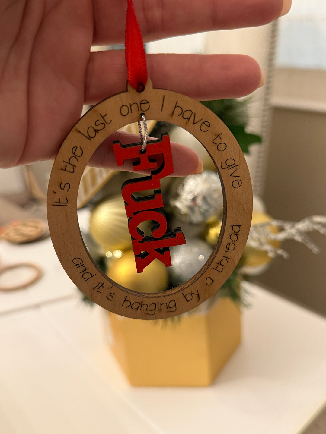 “Hanging by a Thread” Funny Ornament