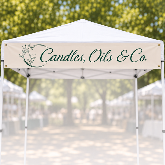 A white pop-up canopy tent with a banner reading &
