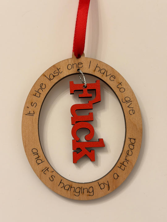“Hanging by a Thread” Funny Ornament