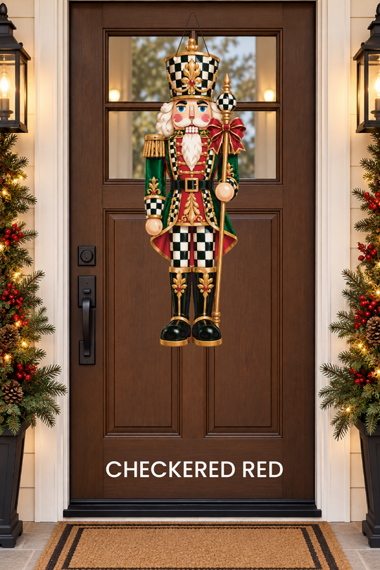 A checkered red nutcracker door hanger on a door