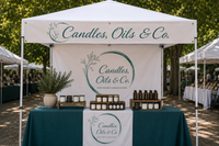 Tent with 'Candles, Oils & Co.' branding at an outdoor event.